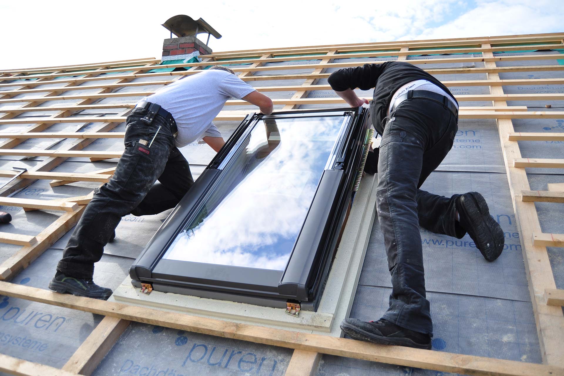 two men assembling a roof skylight window 2022 09 23 16 16 27 utc 1
